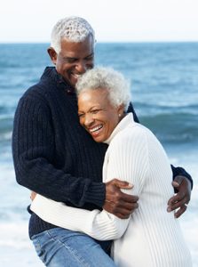 Happy couple with dental implants from Kelowna dentist