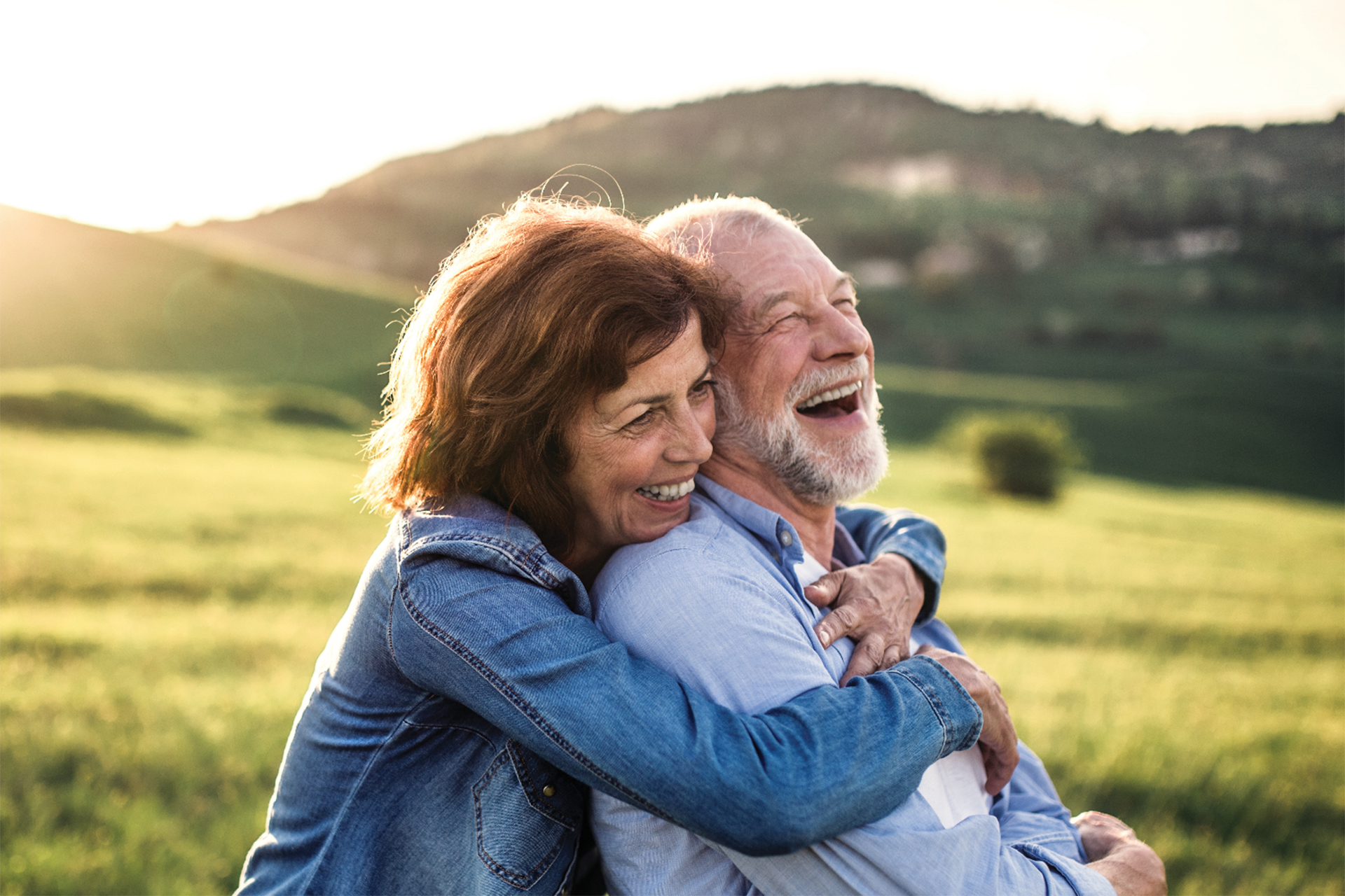 Couple laughing about loose dentures in Kelowna