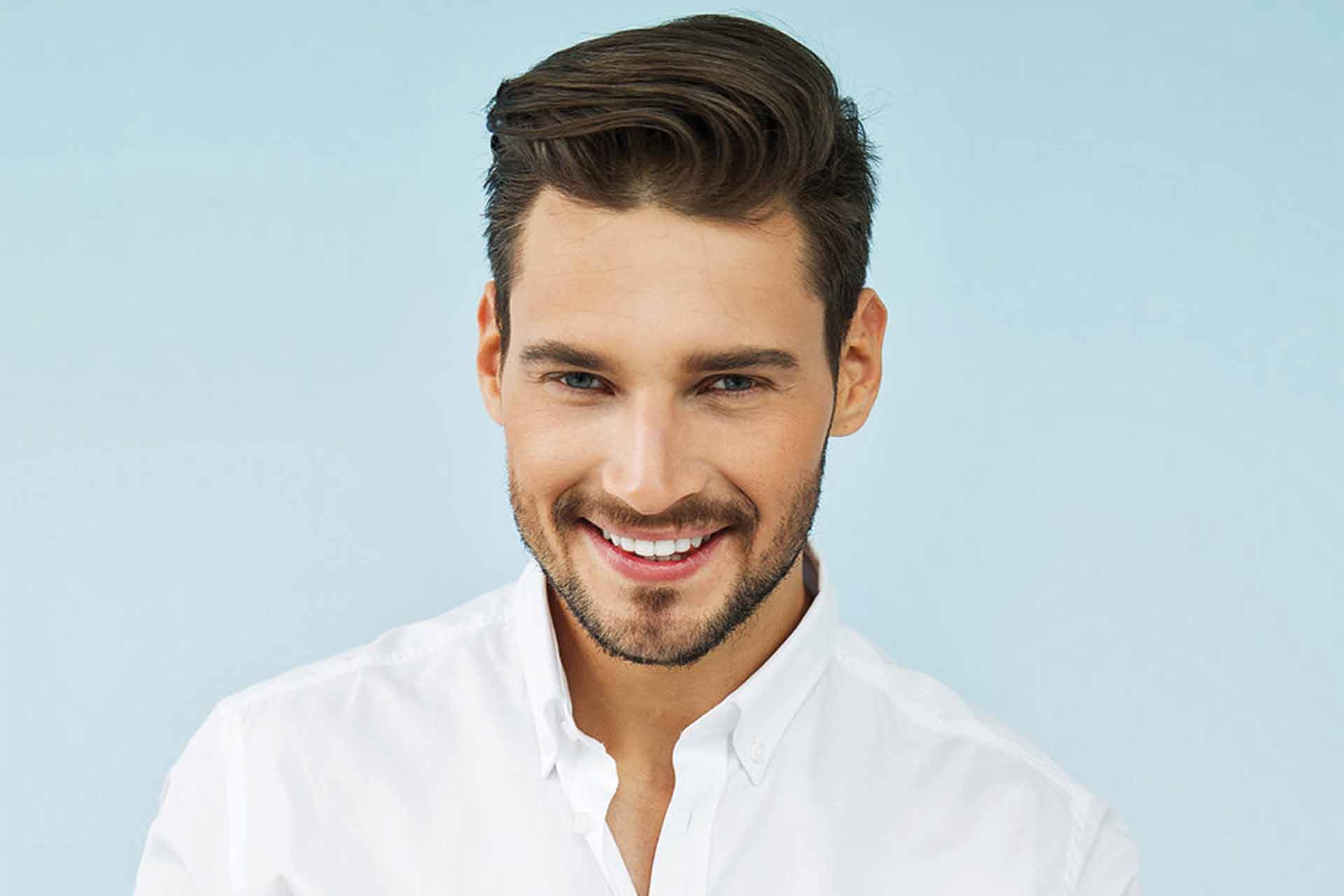 Man with white teeth from teeth whitening treatment